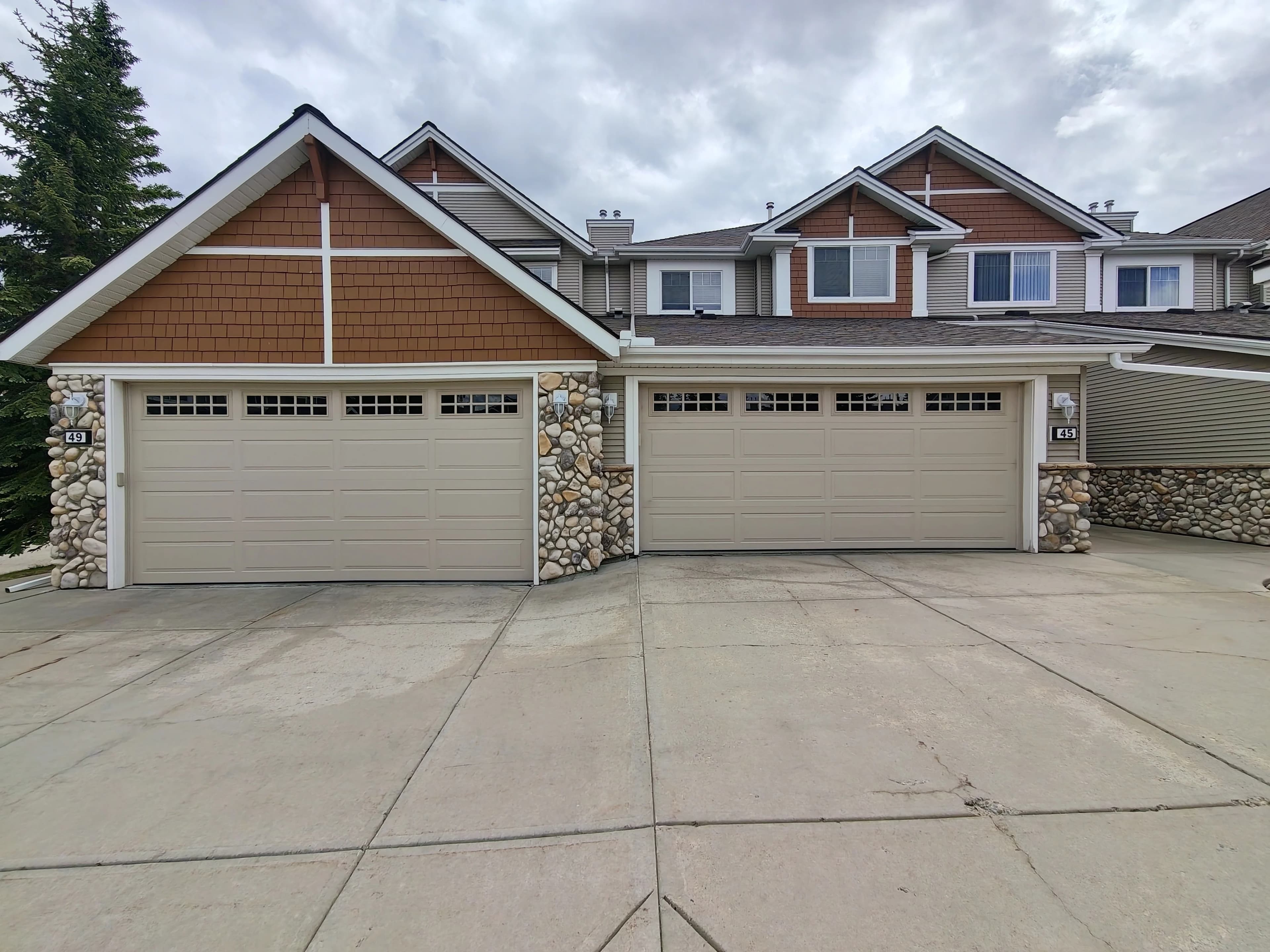 Northland Sandstone R18 insulated garage doors installed at Discovery Heights SW Calgary