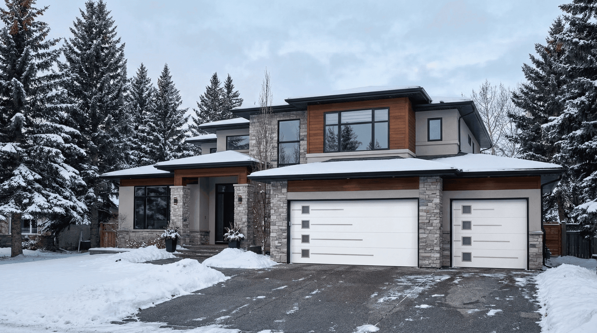 Four sample Ryterna entry-tier sectional garage doors for Saskatoon homeowners