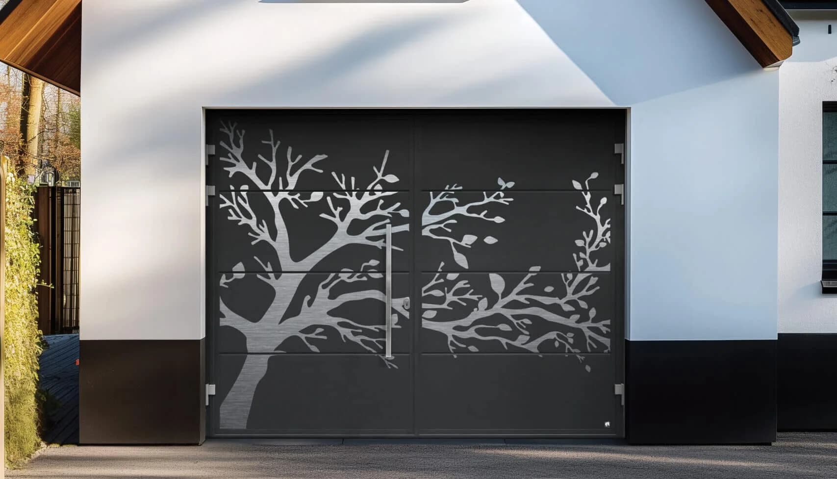 Two side-hinged garage door leaves open across the apron