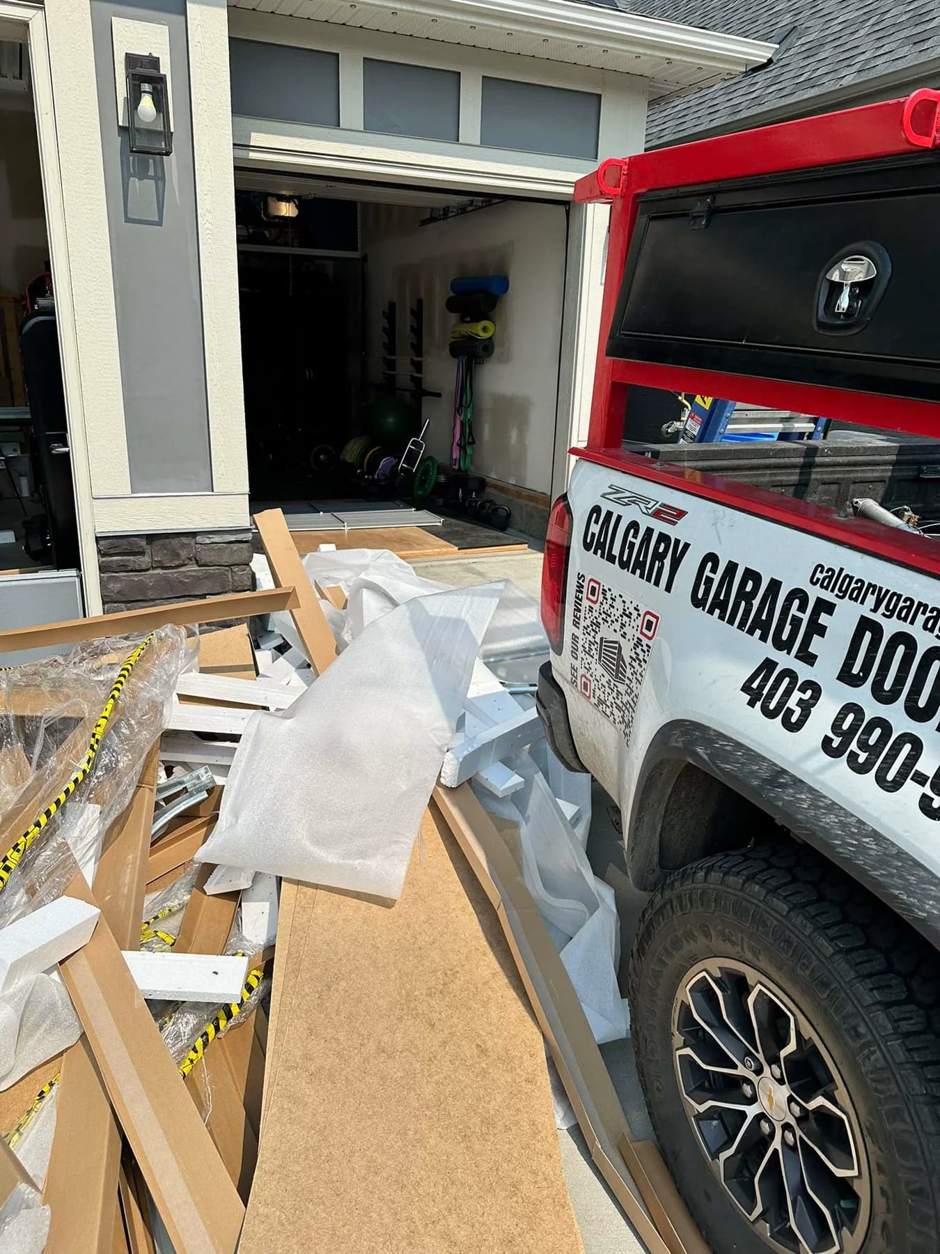 Close view of cardboard foam and protective wrap from a Ryterna garage door delivery