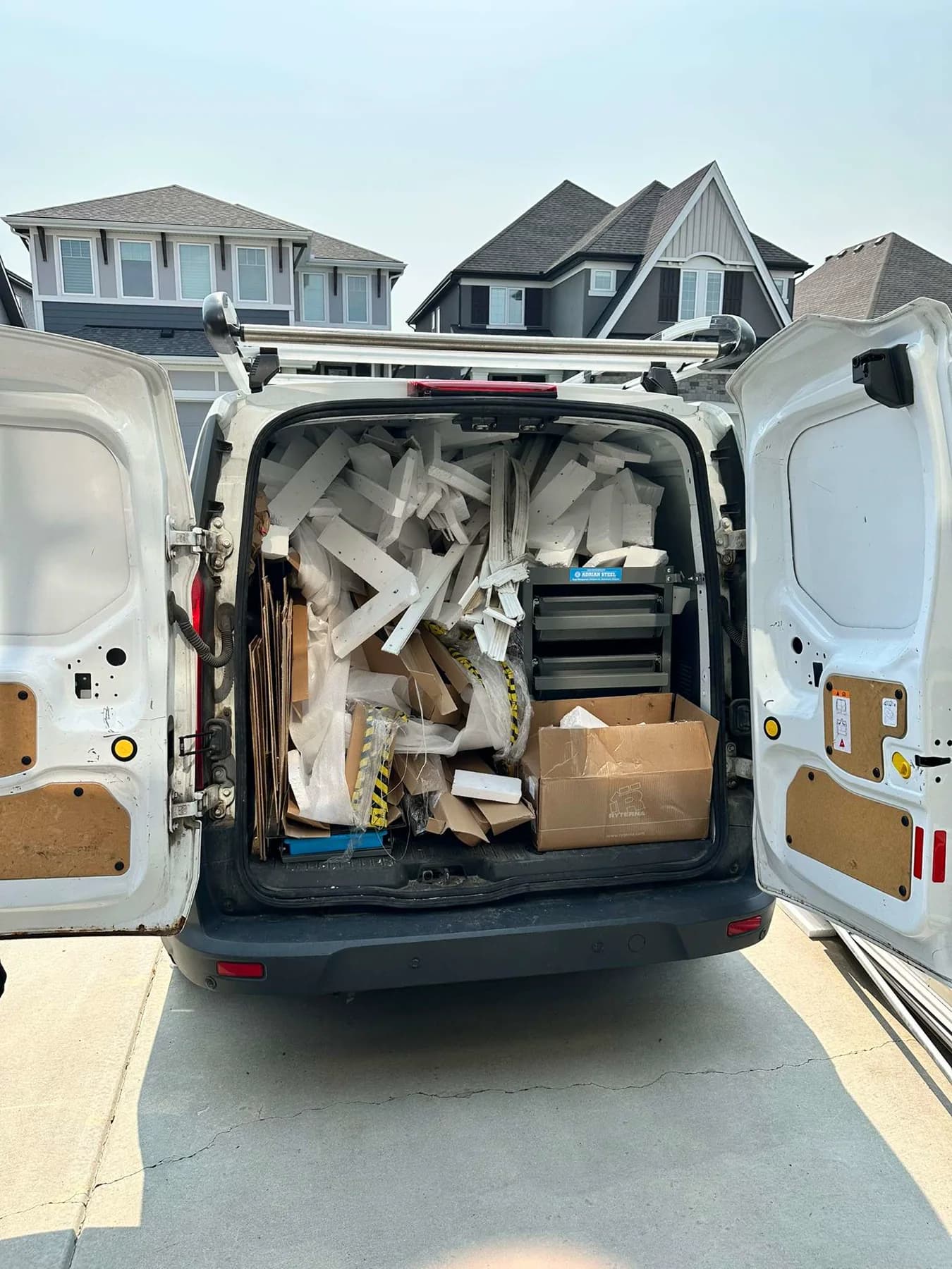 Garage Door Fix van loaded with protective Ryterna door packaging after installation