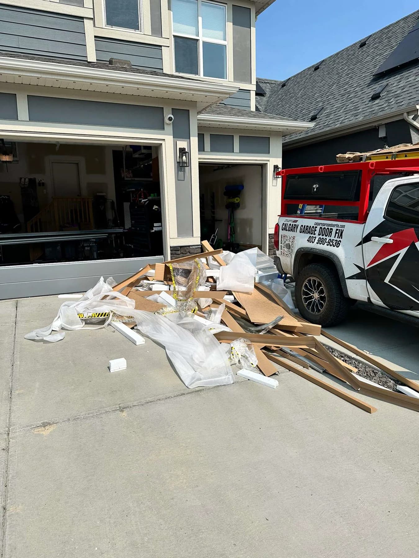 Protective packaging removed from two Ryterna garage doors during a Calgary installation