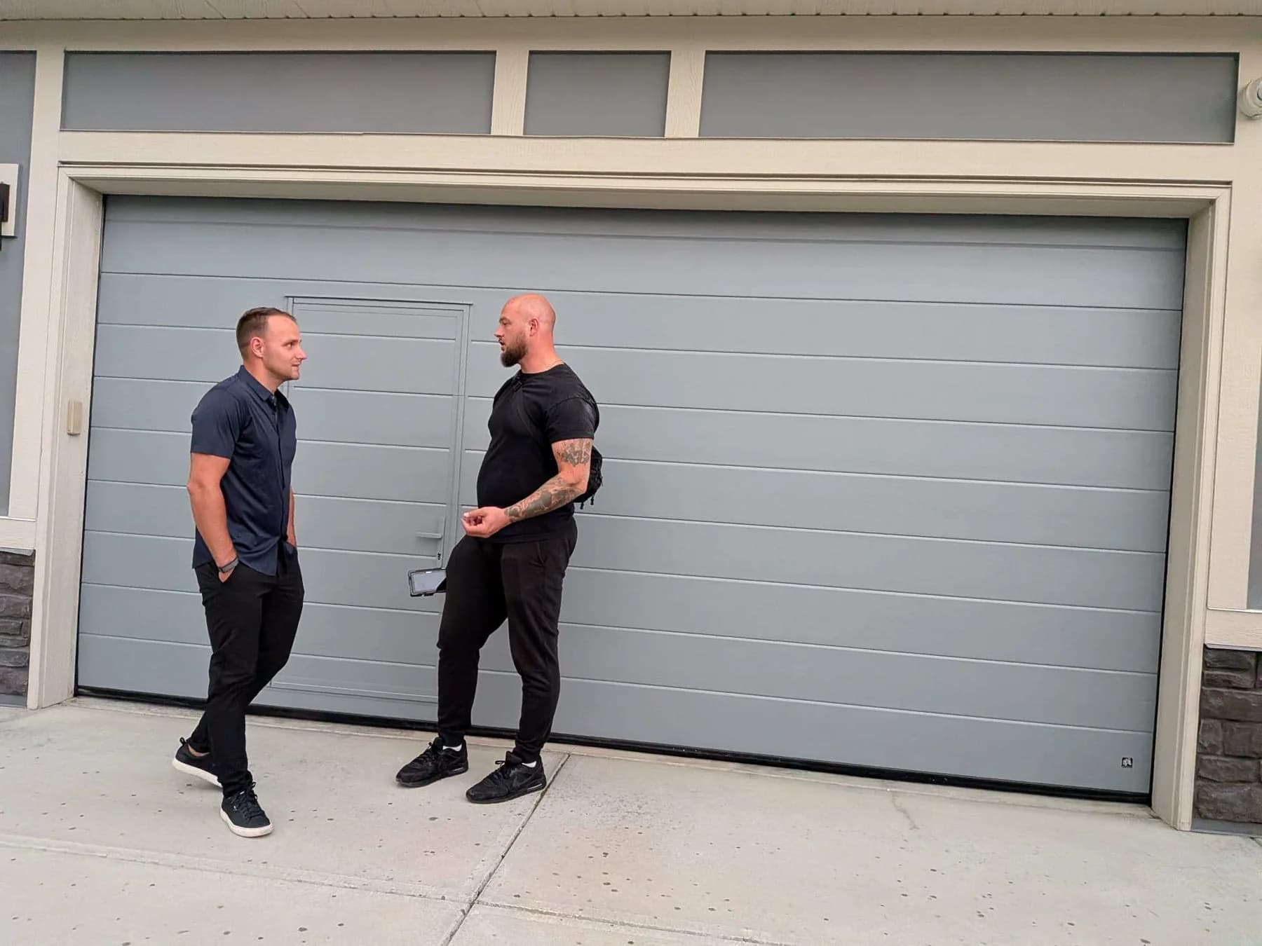 Garage Door Fix filming the finished Ryterna walk-through garage door for an installation video