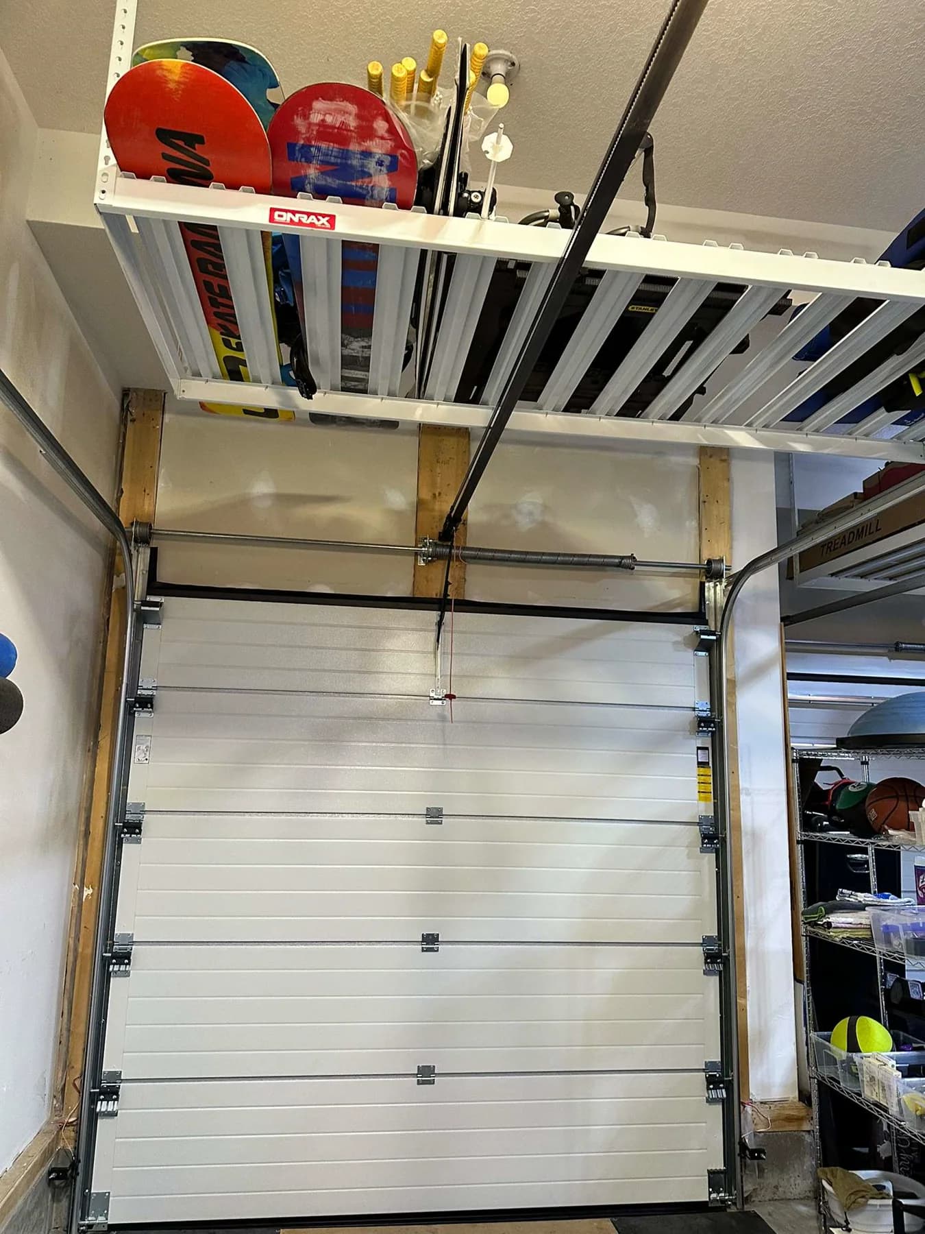 Interior view of the matching 9 by 8 Ryterna single garage door in Mahogany Calgary