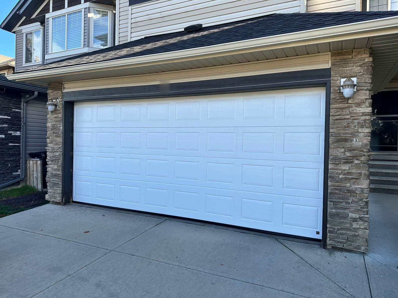 White Ryterna Cassette garage door installed on an Edmonton home