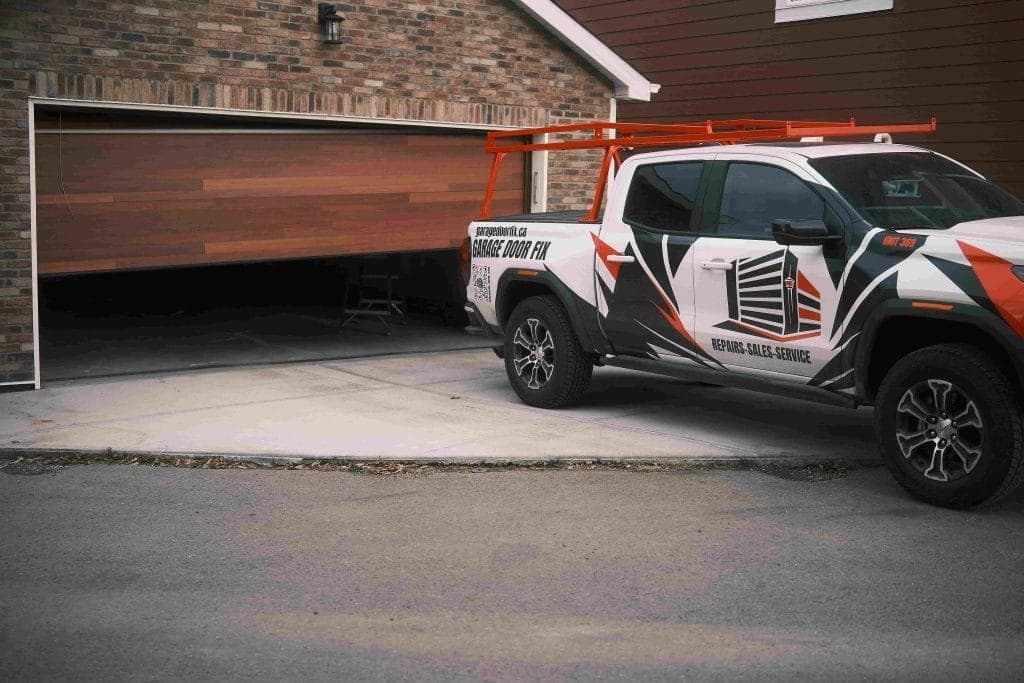 Close-up of garage door cable and drum system